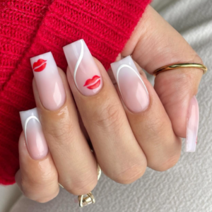 Close-up of beautifully designed Valentine’s Day nails featuring red lips design with some white lines