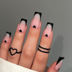 Beautiful nails with black french tips and black hearts