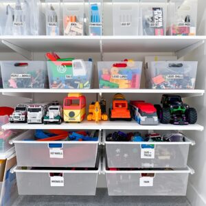 Clear storage bins with colorful labels, making it easy to sort and find toys by category without creating a mess.