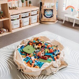 A drawstring play mat filled with small toys, easily bundled up after playtime for quick and organized clean-up.