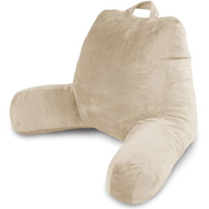 Comfortable foam reading pillow with arm support for cozy book reading.