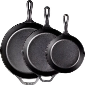 A well-seasoned cast iron skillet cooking a delicious meal on the stovetop.