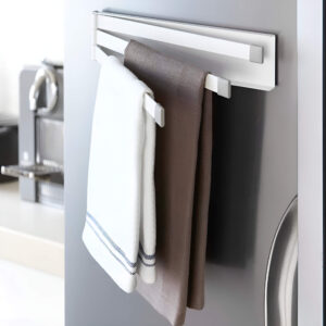 A foldable wall-mounted drying rack that saves space when not in use, perfect for small bathrooms.