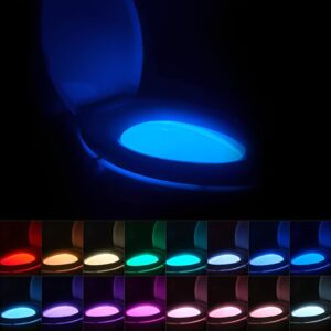 A glow-in-the-dark toilet seat emitting a soft green or blue glow in a dimly lit bathroom.