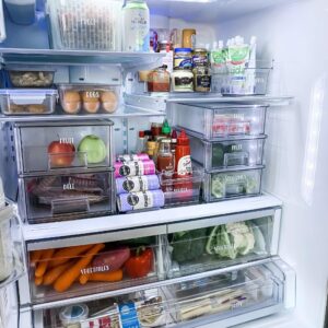 Labeled fridge containers for a clutter-free and organized refrigerator.