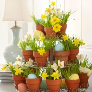 Cheerful Easter centerpiece with potted mini daffodils in terracotta pots, tied with pastel ribbons, arranged together on a table.