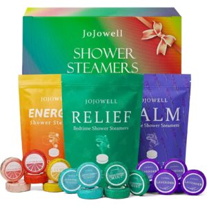 A set of colorful shower steamers releasing soothing steam in a bathroom.