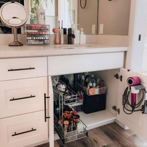 Clever under-sink storage with shelves and baskets to maximize bathroom space.