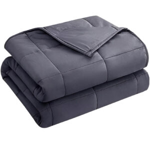 A cozy weighted blanket draped over a couch, ready for relaxation.